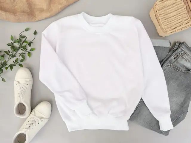 Folded white sweatshirt