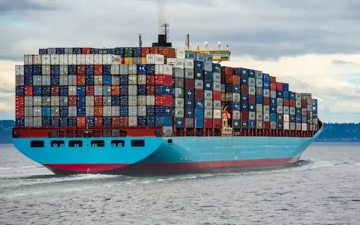 Container ship loaded with containers at sea