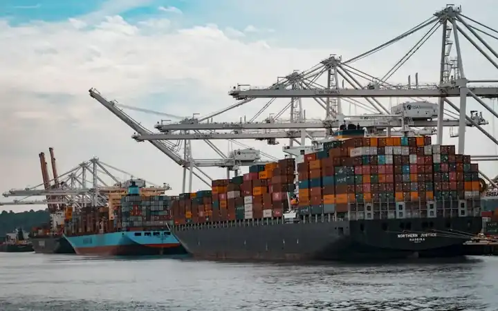 Container ship alongside gantry cranes at a port